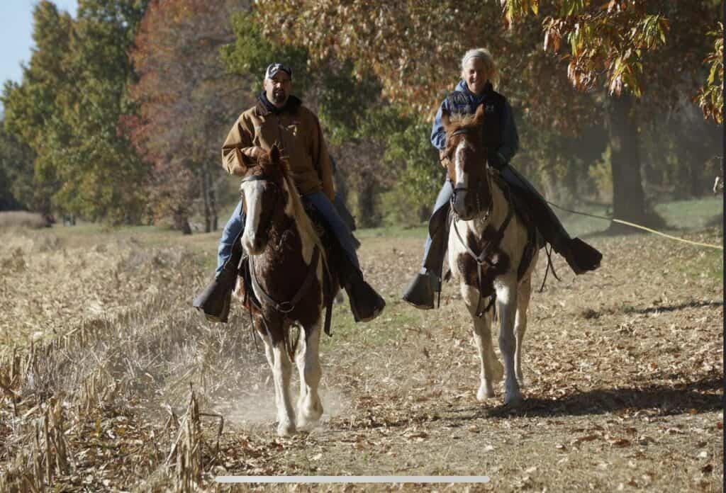 German Shorthaired Pointer field trial with horseback handler